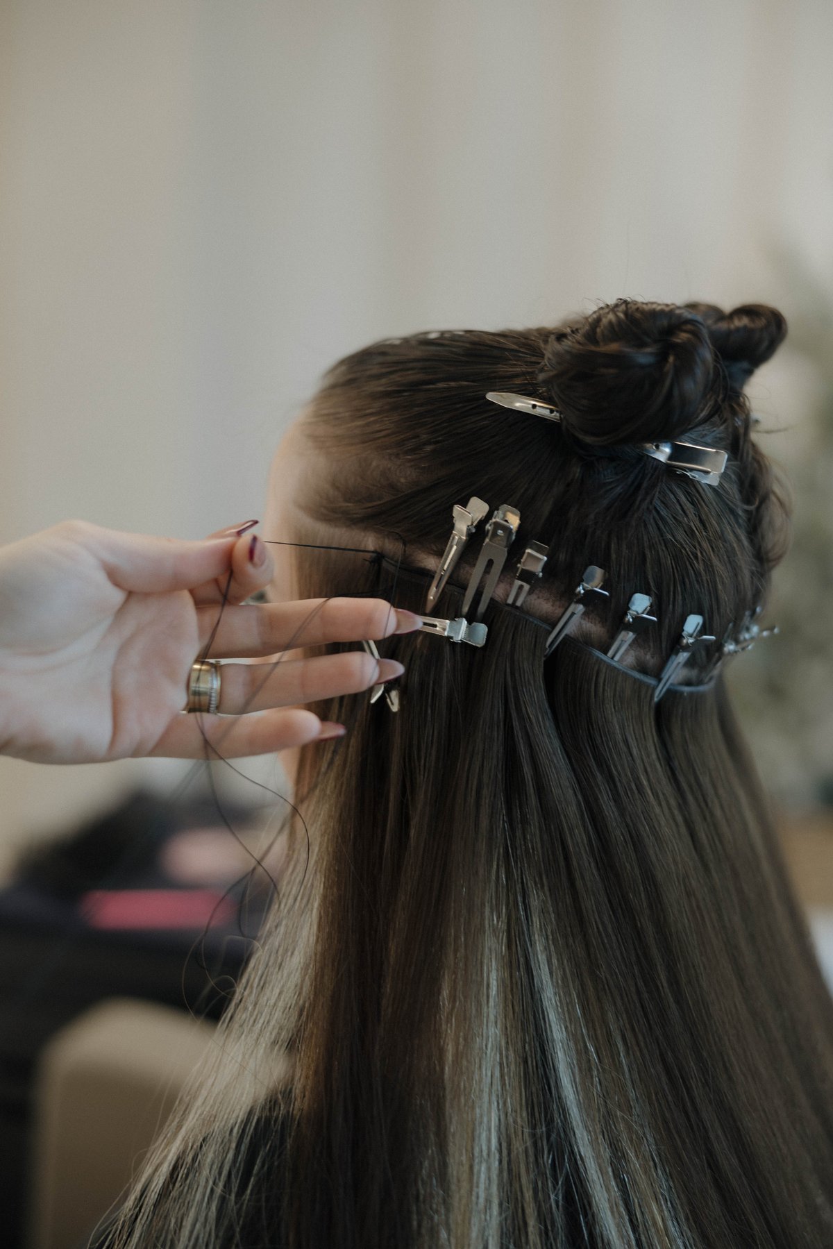 Micro K-tip strands mid-install at Luxe & Mane Co