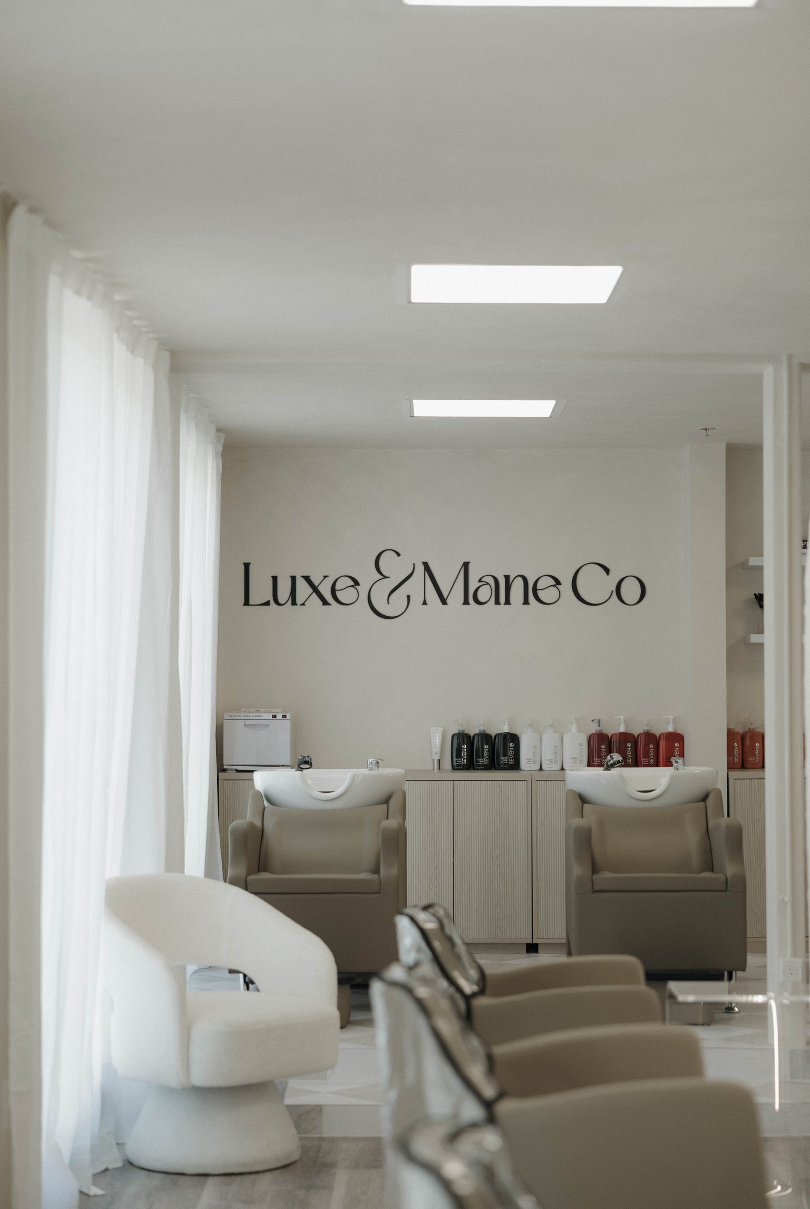The Luxe & Mane Co sign inside the salon