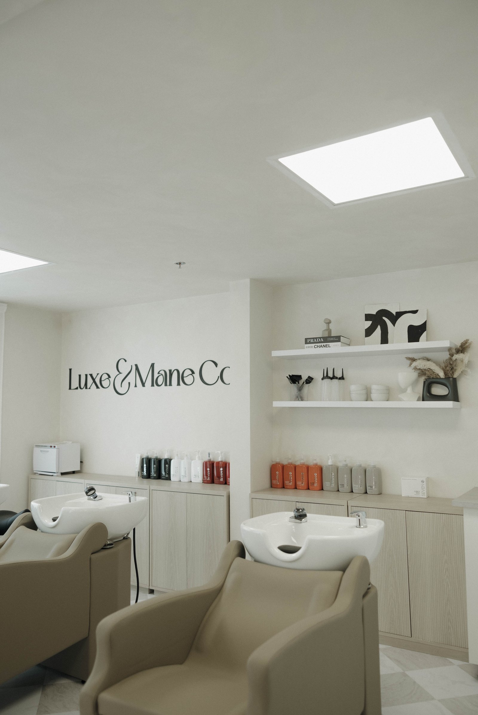 Inside the light, airy Luxe & Mane Co salon