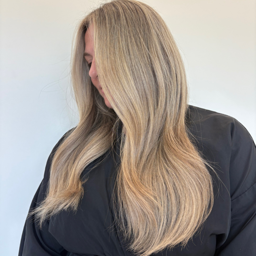 A soft lived-in blonde leaving Luxe & Mane Co